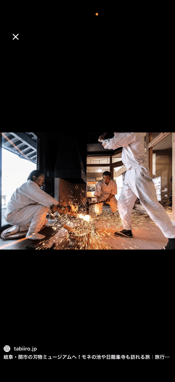 Seki forge craftsmen hammering steel with sparks flying — traditional Japanese blade craftsmanship